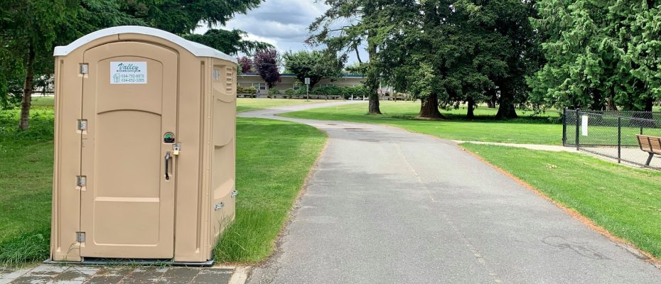 valley waste portable toilet seen in a park